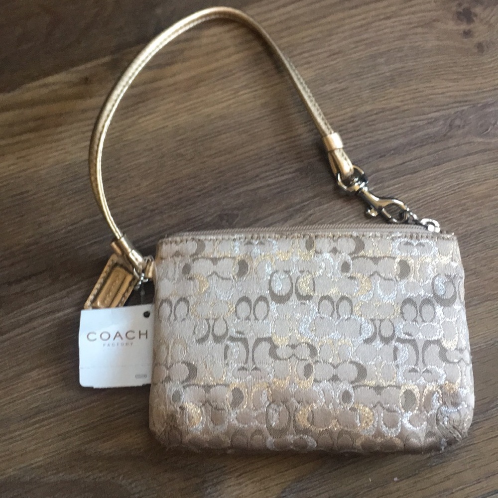 Coach Wristlet with flowery signature print